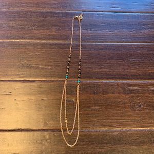 Gold tone black and teal beaded necklace